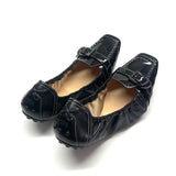 Tod’s black patent leather buckle slip on ballet shoes