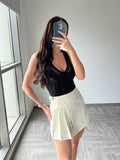 Revolve white pleated skirt